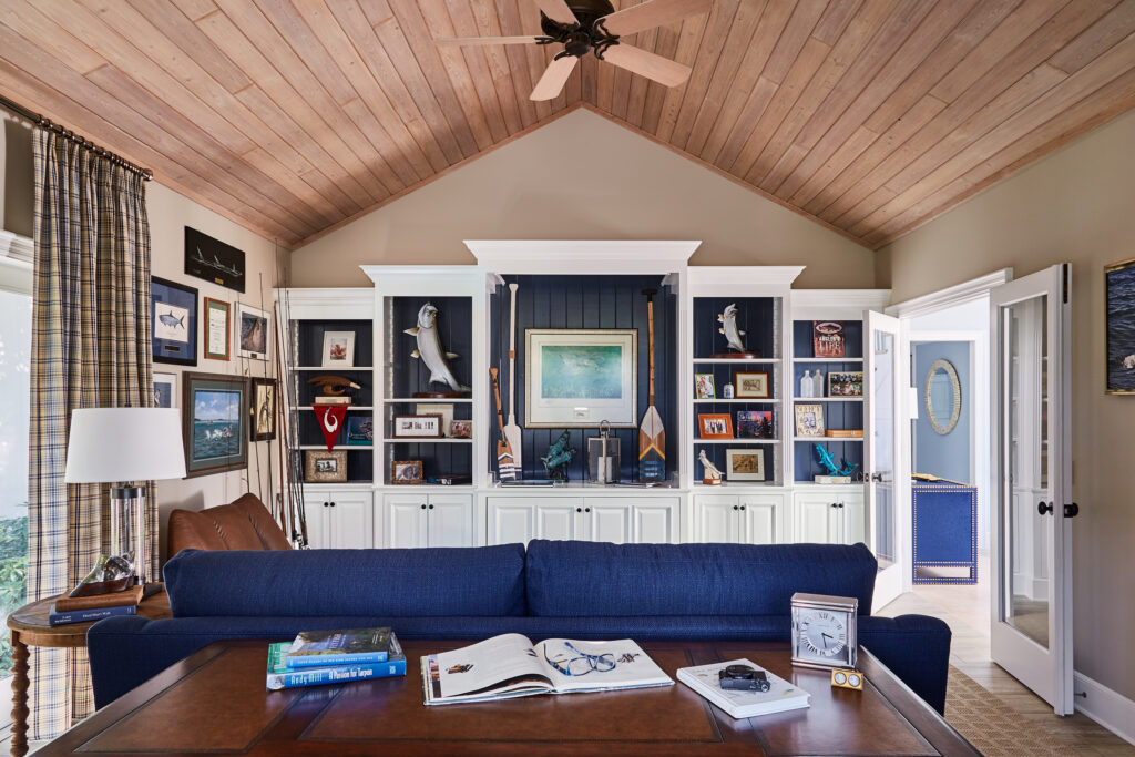 wood  and navy nautical living with built in shelves