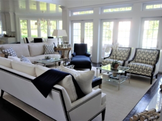 navy and white living room with French doors