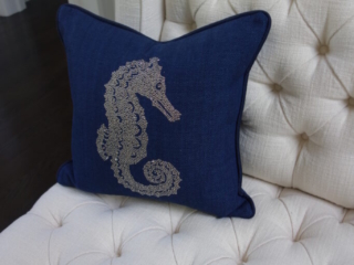 Tufted white chair with embellished pillow