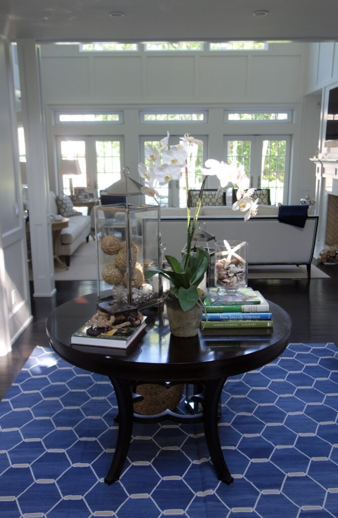 foyer with blue and white rug