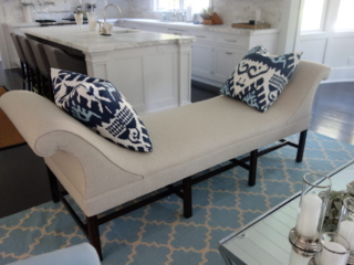 Tan bench with blue decorative pillows