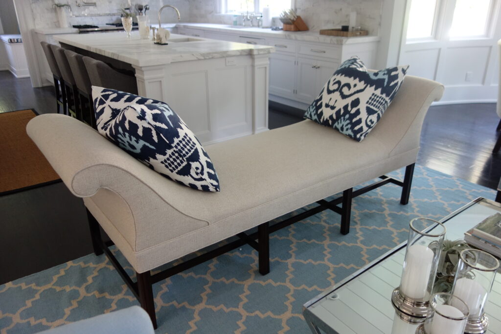 Tan bench with blue decorative pillows