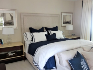 Tan headboard with navy and white bed set