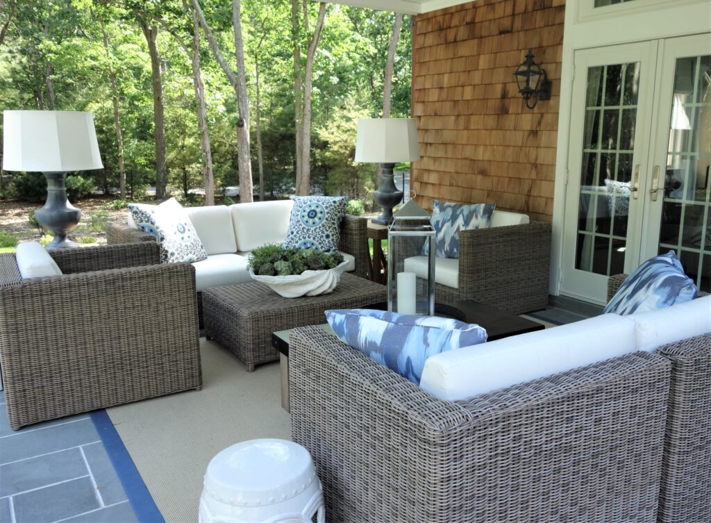Gray wicker outdoor patio set with white cushions