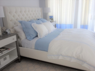 Baby blue and white bedroom with gray wood