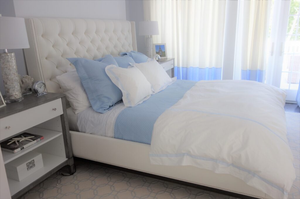 Baby blue and white bedroom with gray wood