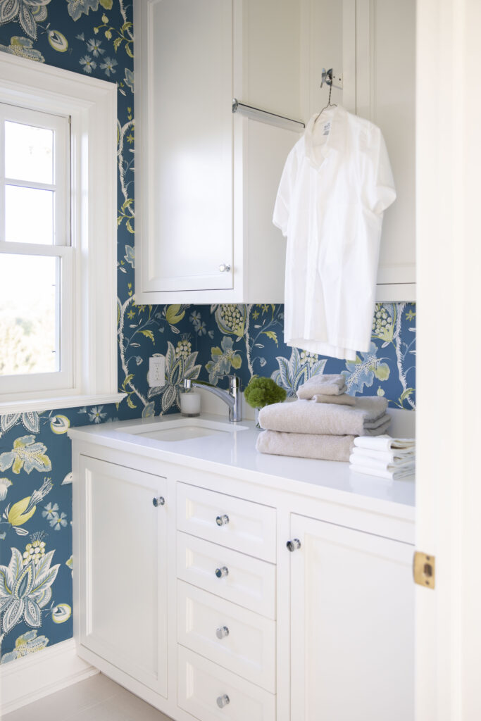 Blue and green wallpaper in a modern laundry room