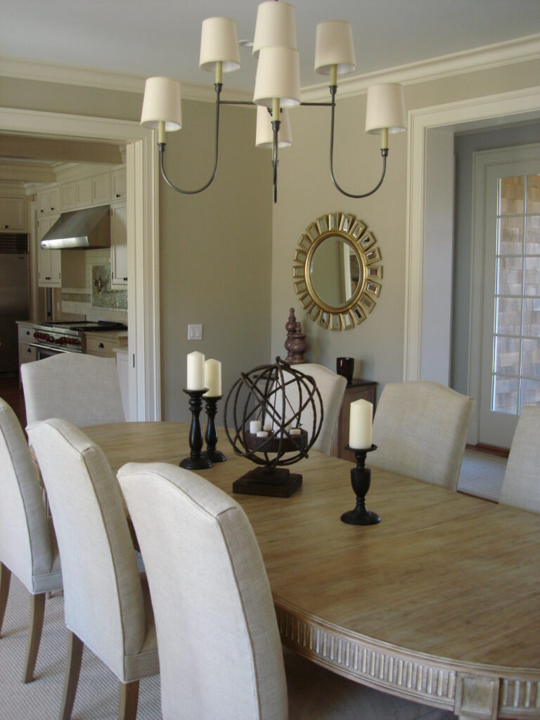 Large oval dining table with hanging chandelier