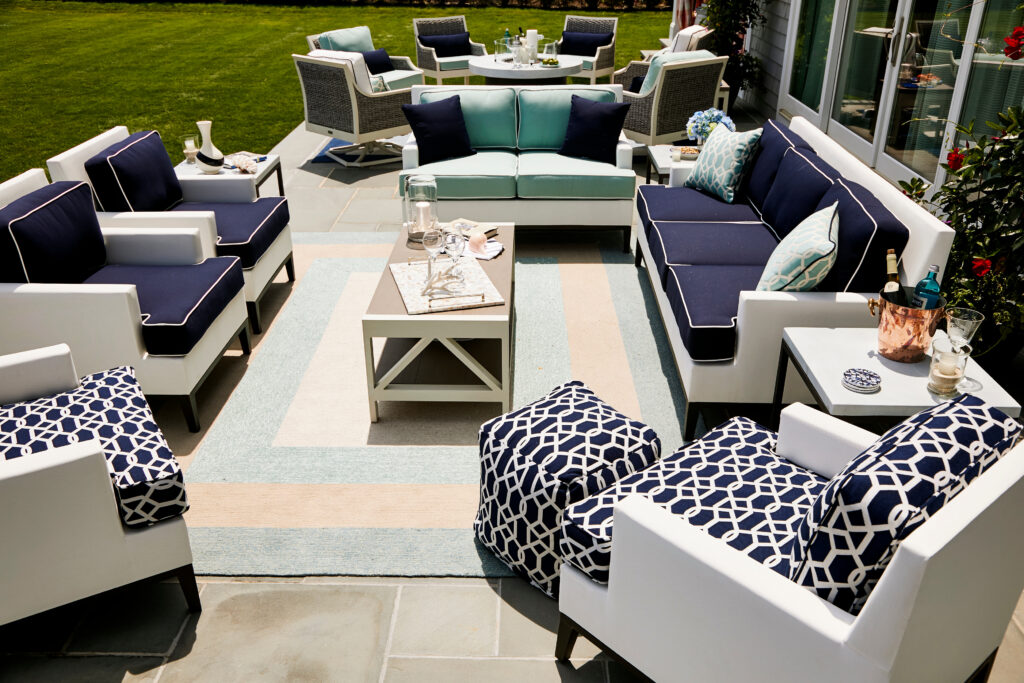 White outdoor furniture with navy cushions