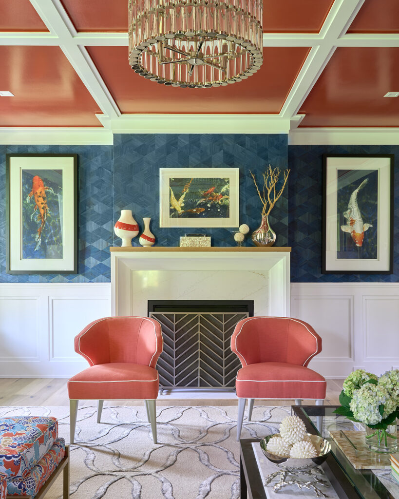 Fireplace with two salmon colored chairs
