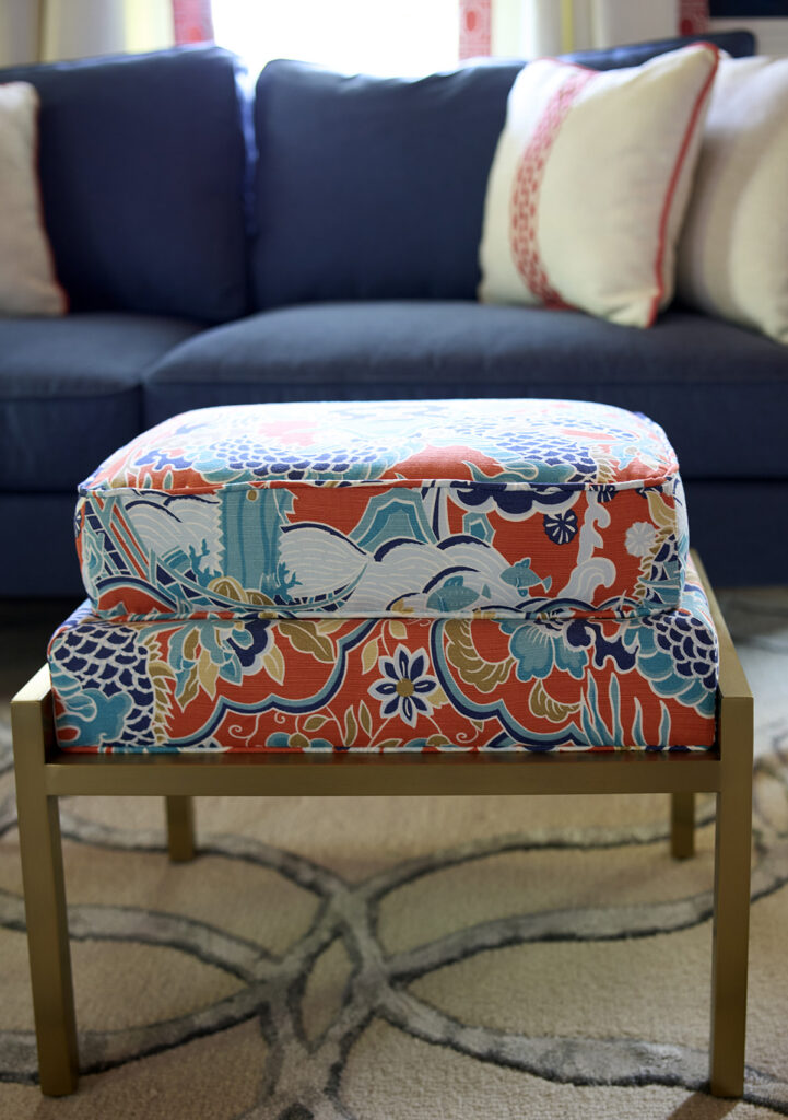 Double cushioned stool with blues and salmon