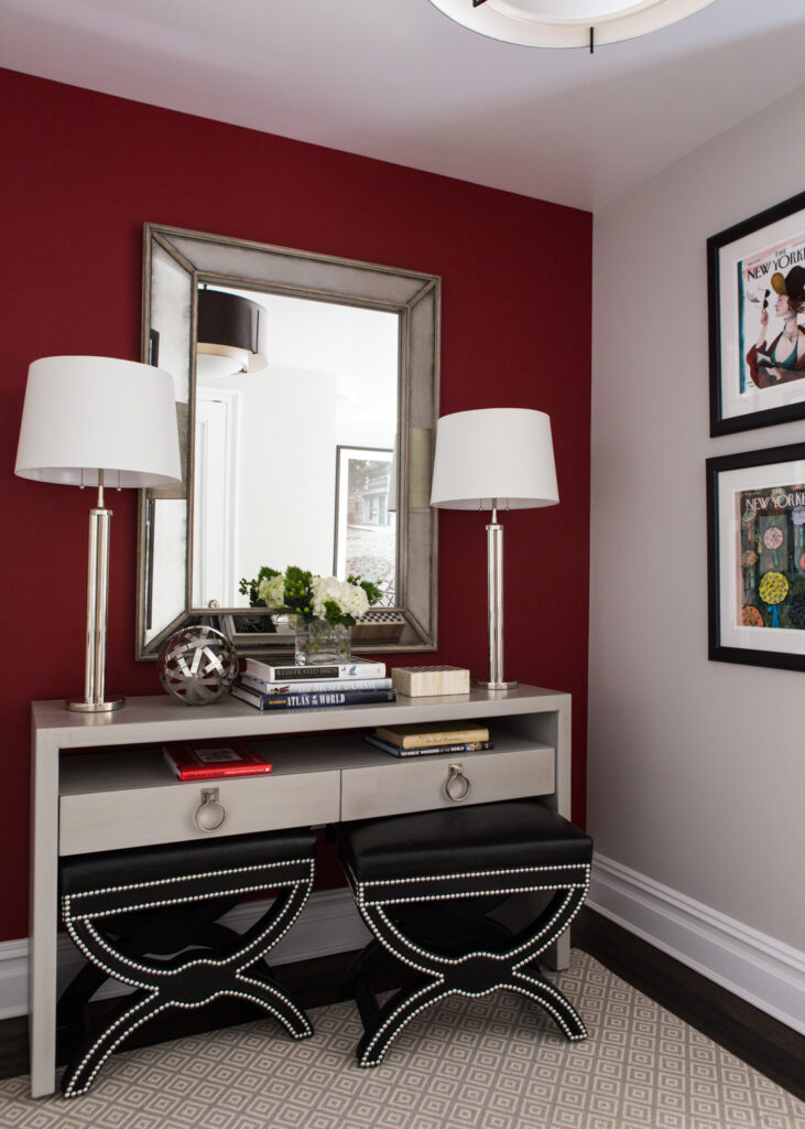 Red accent wall and console table