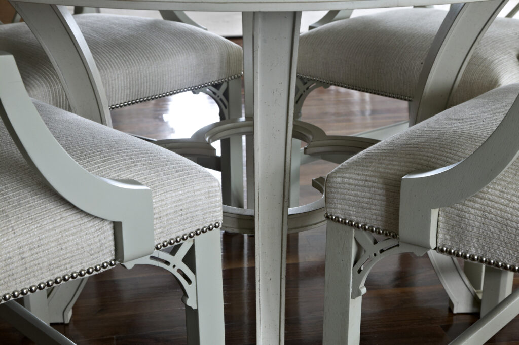 Light green dining chairs with nail heads