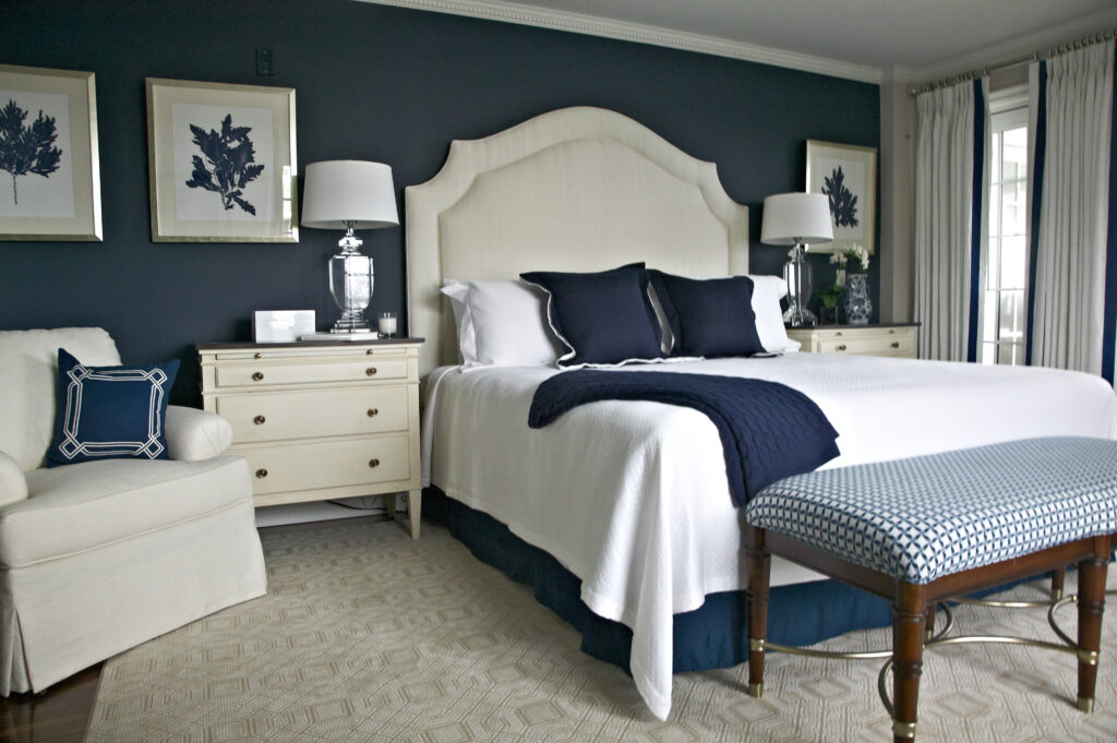 Nautical navy and white bedroom with high headboard