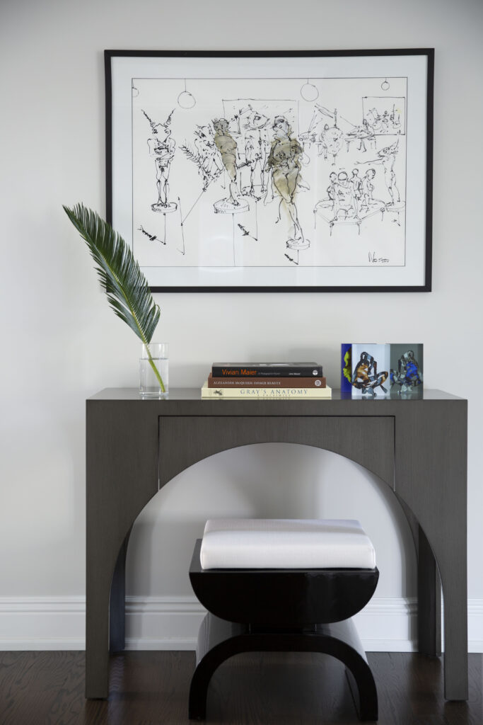 Console table with black and white ottoman