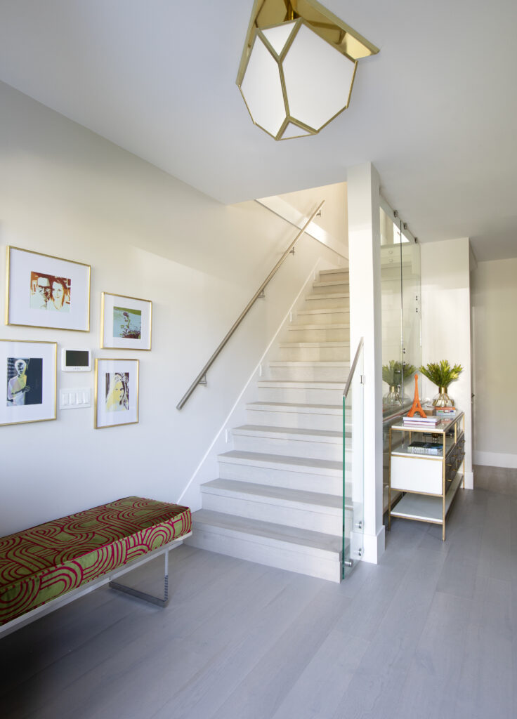 White stairway with glass fixtures