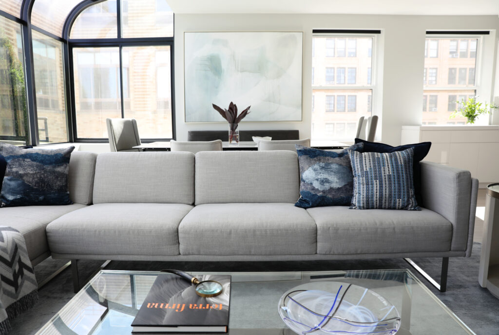 Gray sofa with navy accent pillows