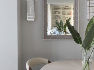 Gray outlined mirror with white and chrome side sconces
