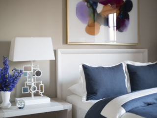 Large colorful art over bed